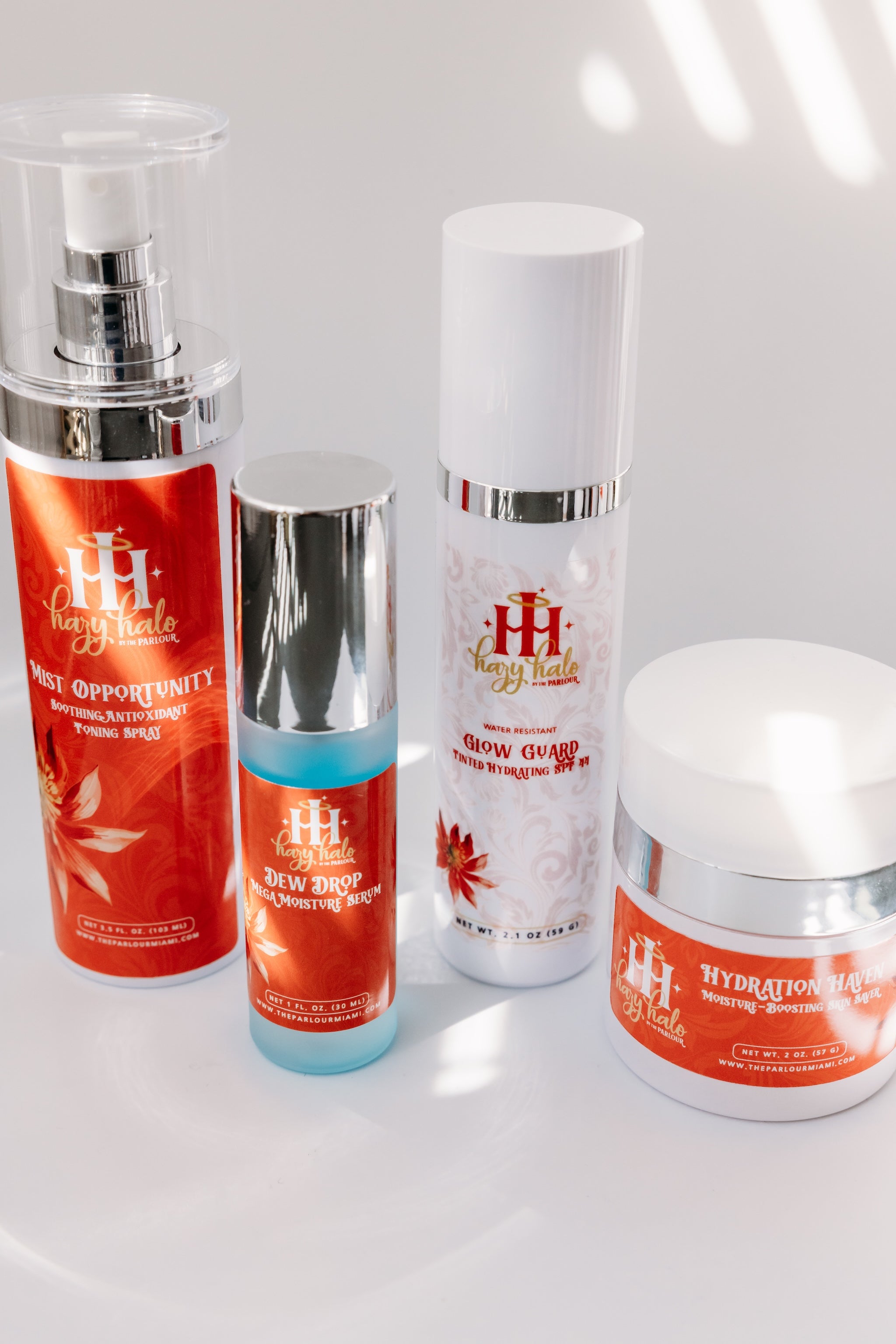 Hydrating skincare collection with hyaluronic acid serum, moisturizer and antioxidant mist.