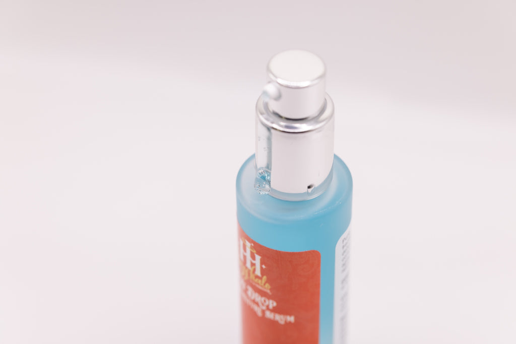 Close-up of Dew Drop Mega Moisture Serum by The Parlour with hydrating gel serum dispensing from the pump, showcasing lightweight hyaluronic acid texture