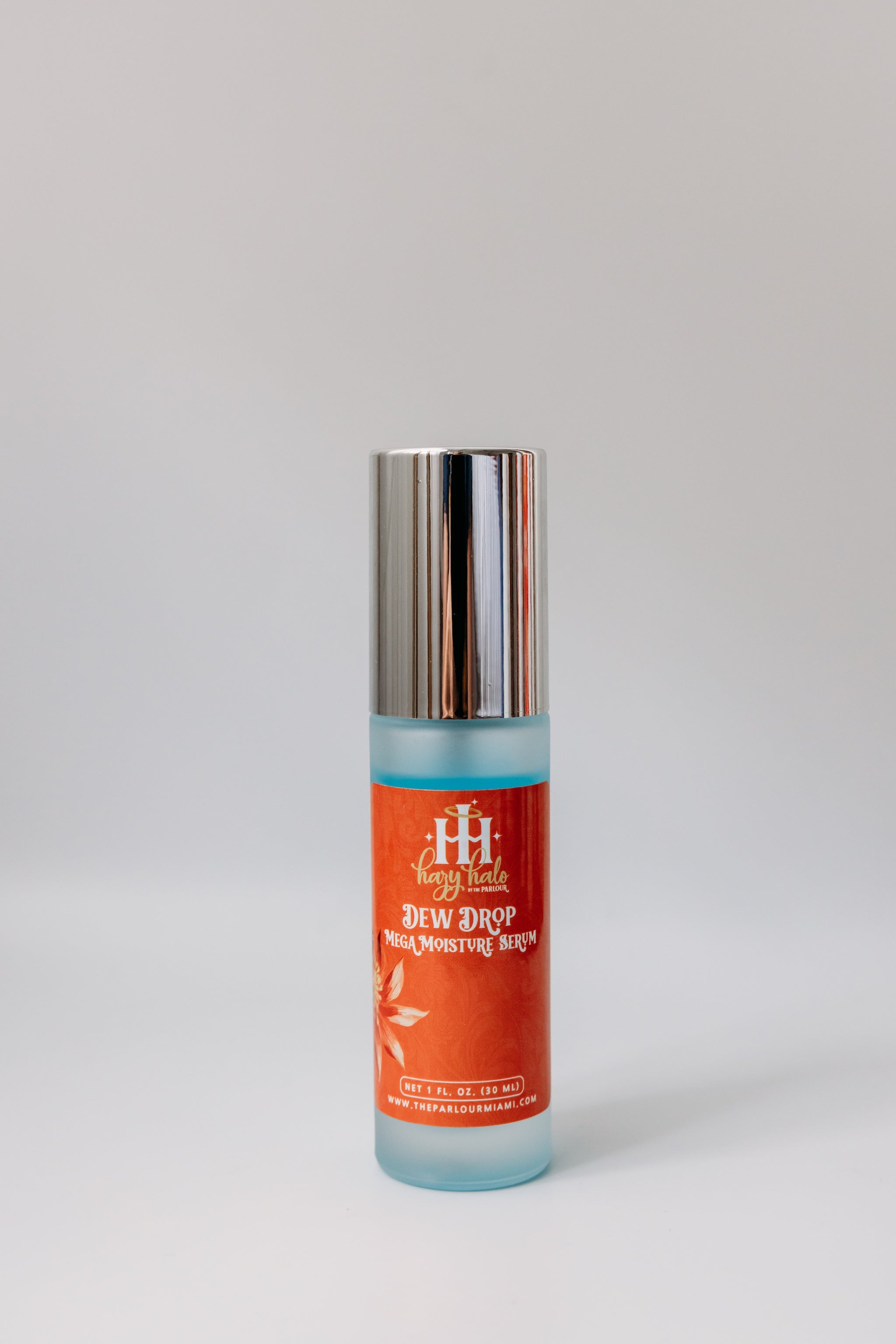 Dew Drop Mega Moisture Serum by The Parlour featuring a sleek hydrating serum bottle with cap on for deep hydration, plumping, and barrier support.