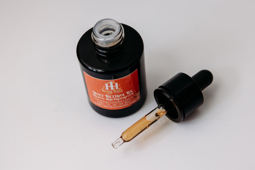 Holy Retinol Rx Nightly Skin Prescription by The Parlour featuring all-trans retinol and bakuchiol for improving fine lines, uneven texture, pores, and skin tone. The dropper allows for easy application.