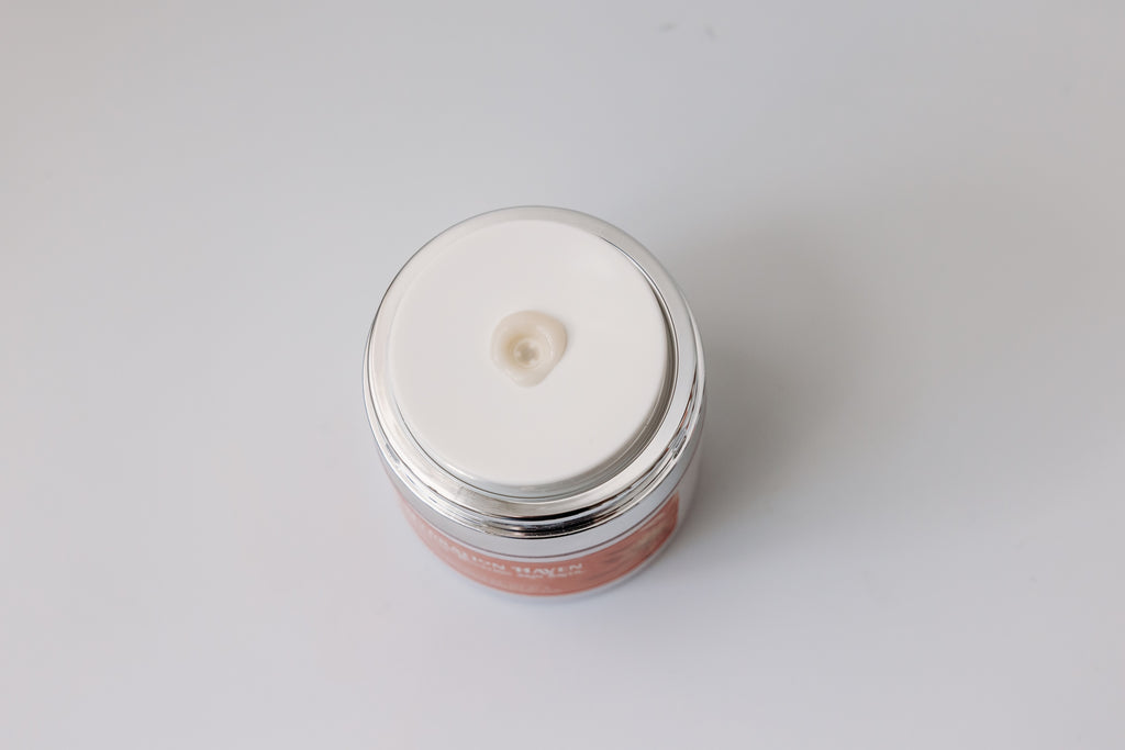 Open jar of Hydration Haven Moisture-Boosting Skin Saver by The Parlour with creamy moisturizer dispensing from the pump, showcasing rich hydrating texture for dry, dehydrated, and aging skin.