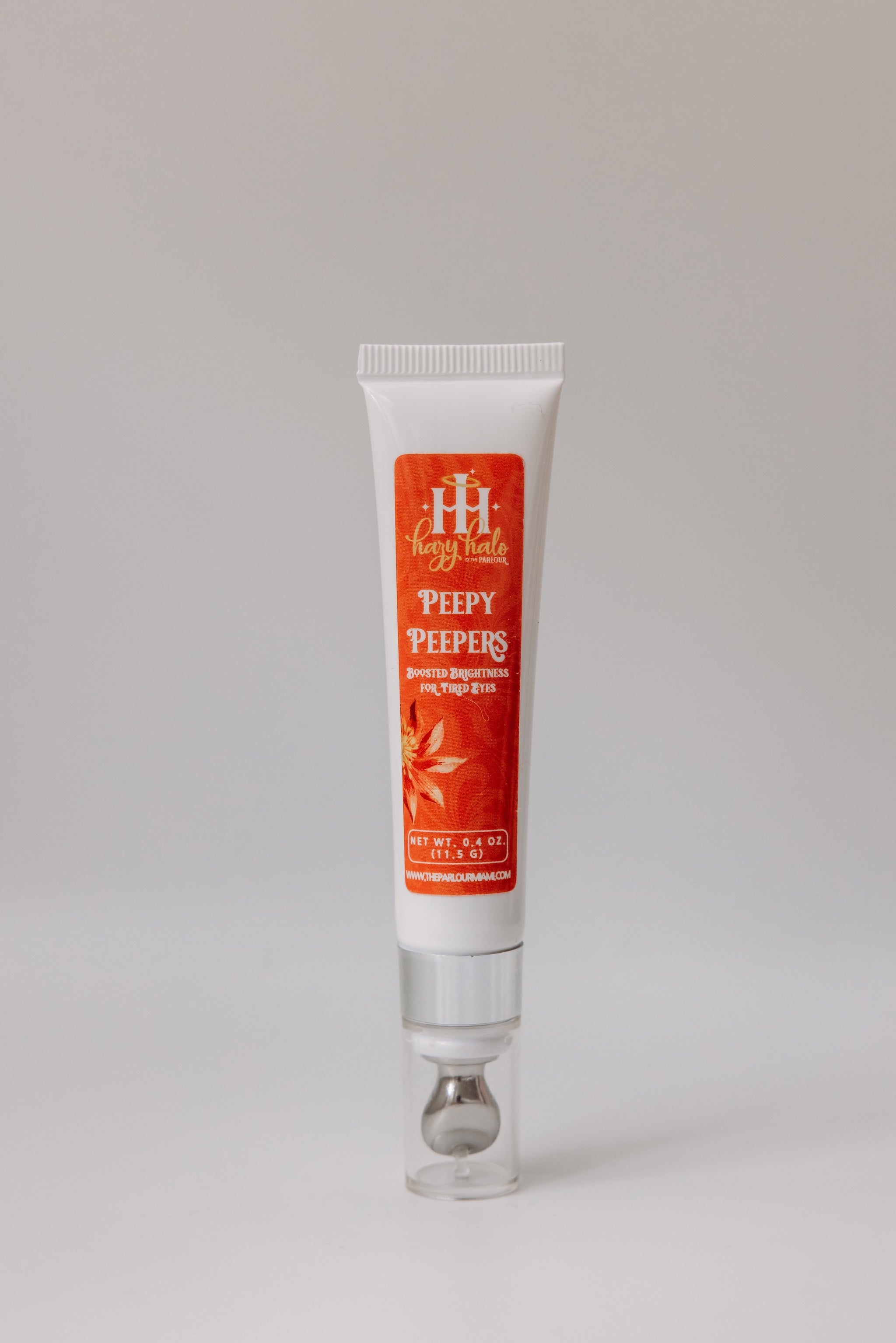 Peppy Peepers Brightening Eye Cream by The Parlour featuring a cooling metal applicator tip for reducing puffiness, hydrating under eyes, and improving dark circles and fine lines.
