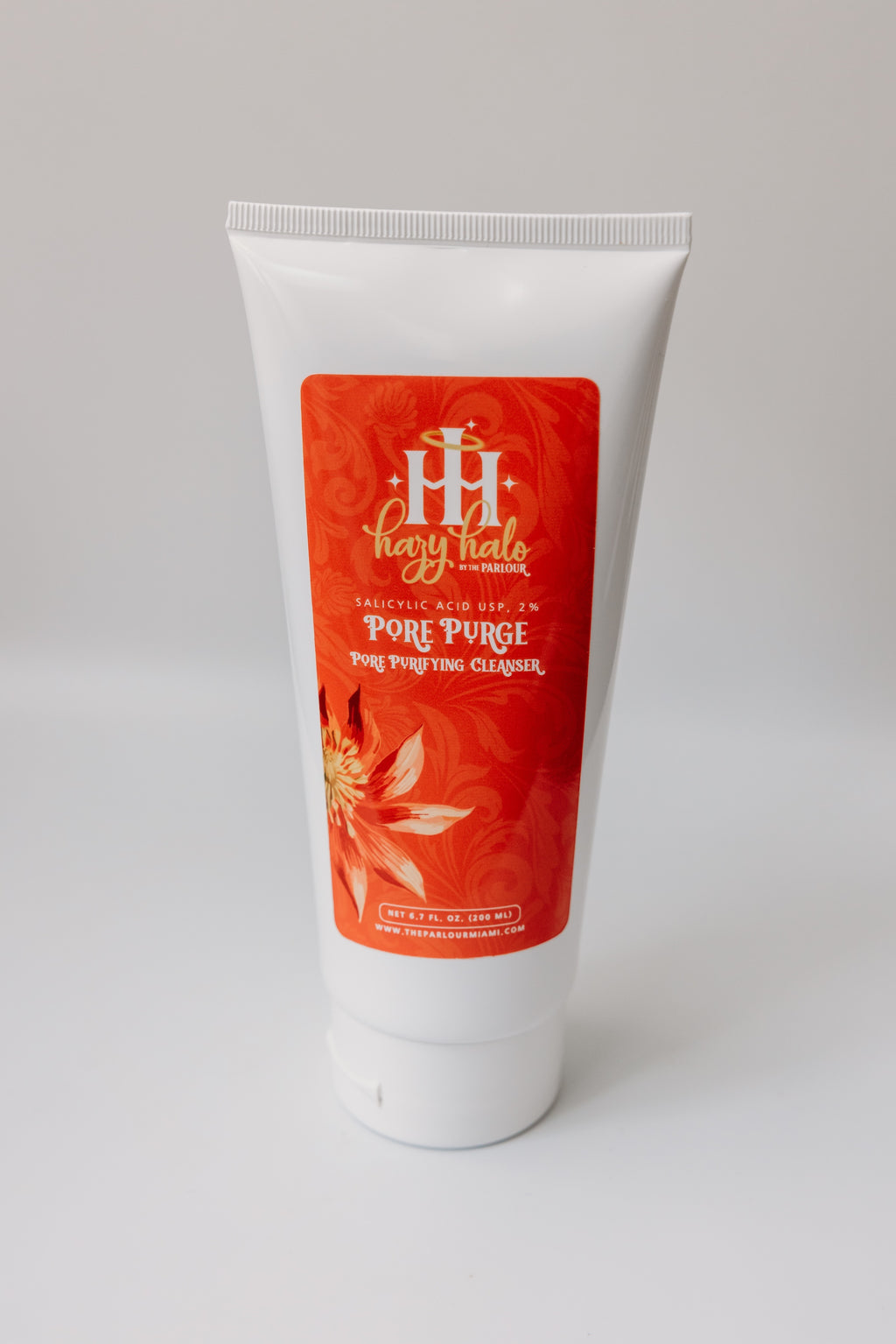 Pore Purge pore purifying cleanser by The Parlour with glycolic acid and salicylic acid for unclogging pores, reducing blackheads, and controlling oily breakout-prone skin.